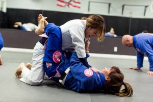 adults drilling Jiu-Jitsu techniques